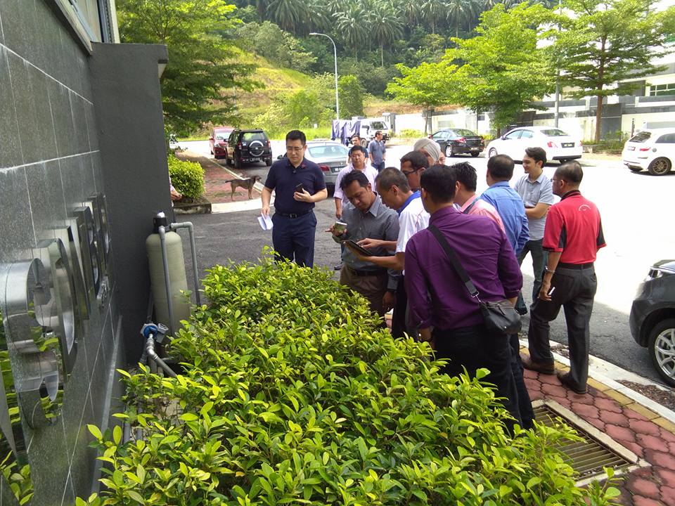 Photo showing Vincent Wong demonstrating live data upon Malaysia's first NB-IoT base station activation, leading an official utility and telco POC site visit.